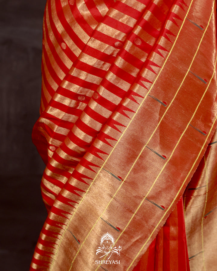 Handloom pure Paithani silk saree with woven zari stripes, delicate bhutis, and traditional Paithani motif designer pallu in vibrant hues