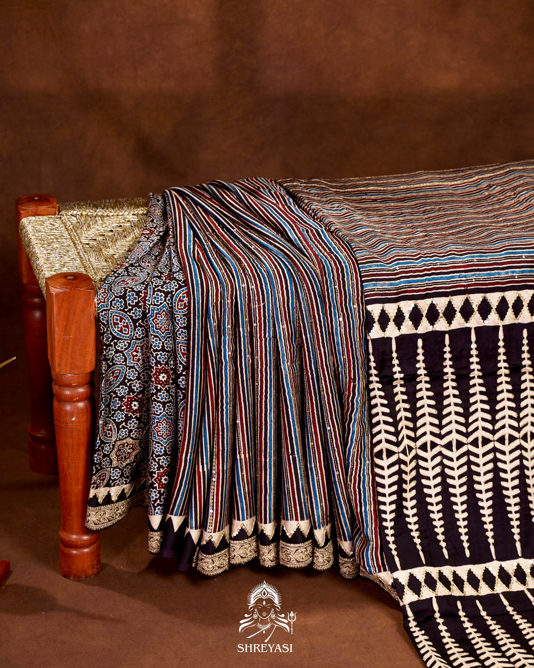 Handloom Pure Modal Silk Ajrakh Hand Block Printed Saree with Natural Dyes, All Over Aari Embroidery & Embroidered Borders