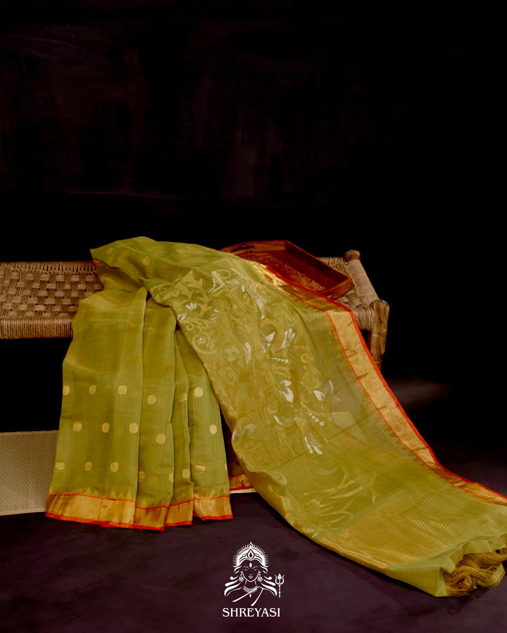 Ponduru Khadi Jamdani saree in olive green with handwoven jamdani motifs and contrast orange border