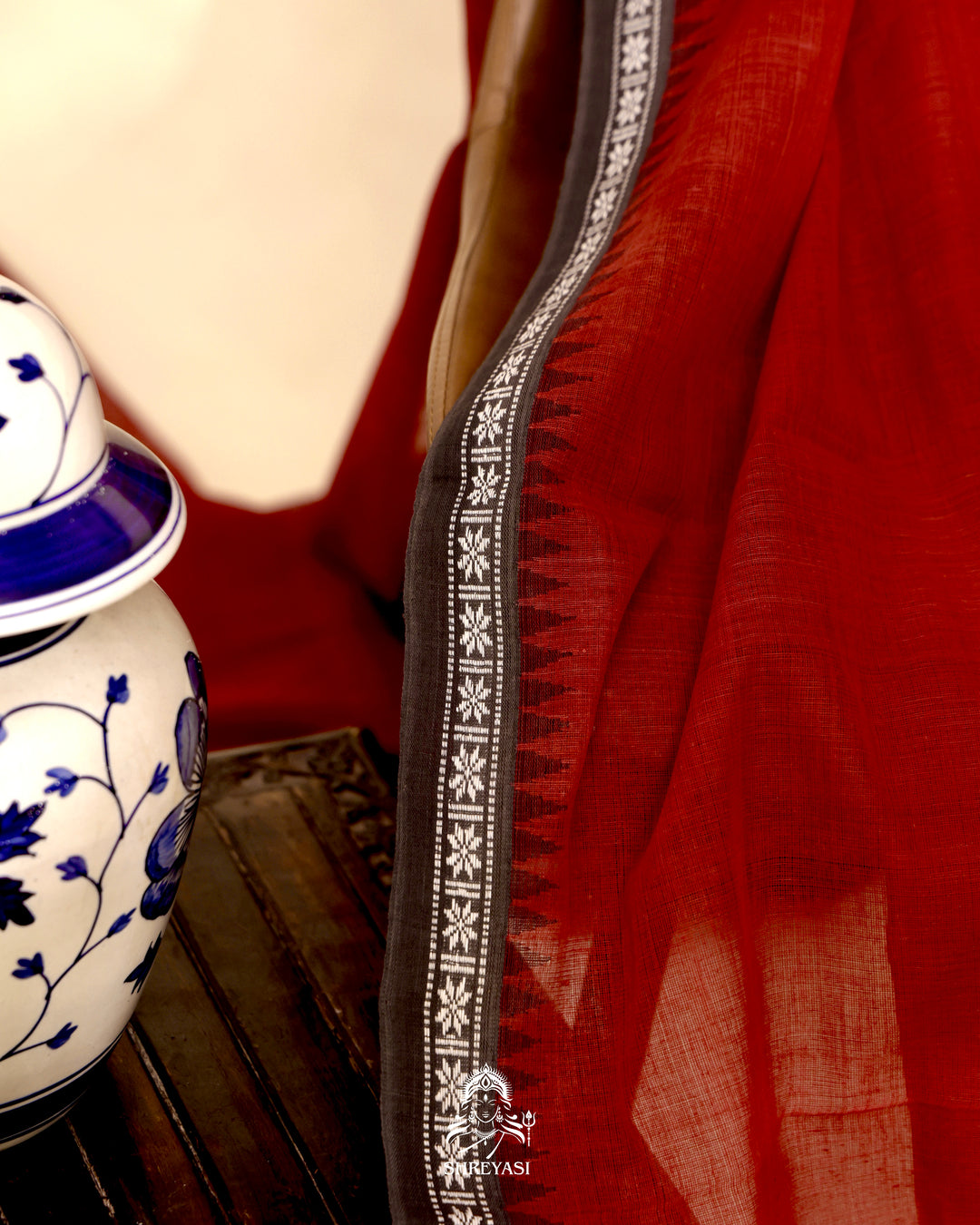 Handloom Bawan Buta cotton saree with contrast borders and a soft breathable drape