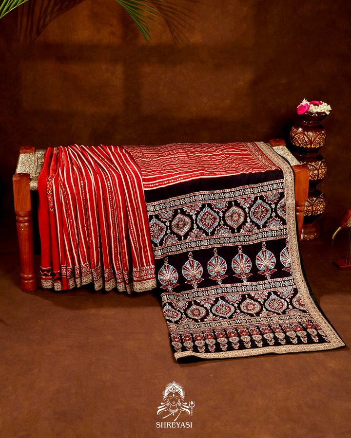 Handloom Pure Modal Silk Ajrakh Hand Block Printed Saree with Natural Dyes, All Over Aari Embroidery & Embroidered Borders