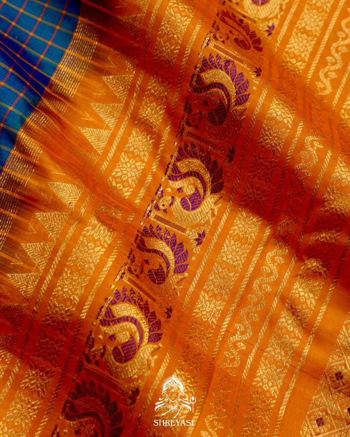 Handloom Pure Gadwal Silk Saree
in Kuttu Weaving and Rich Zari Pallu