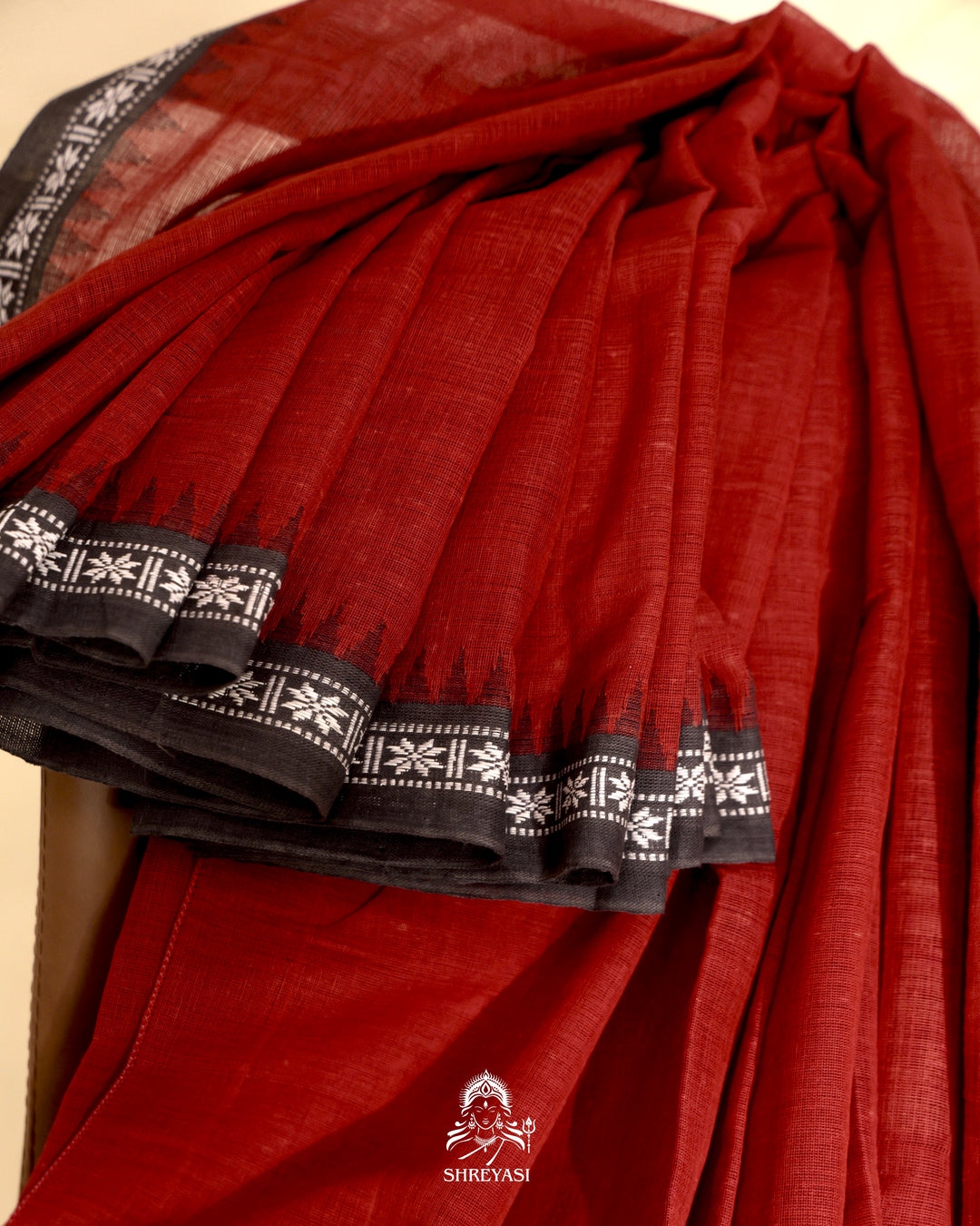 Handloom Bawan Buta cotton saree with contrast borders and a soft breathable drape