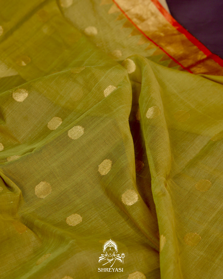 Ponduru Khadi Jamdani saree in olive green with handwoven jamdani motifs and contrast orange border