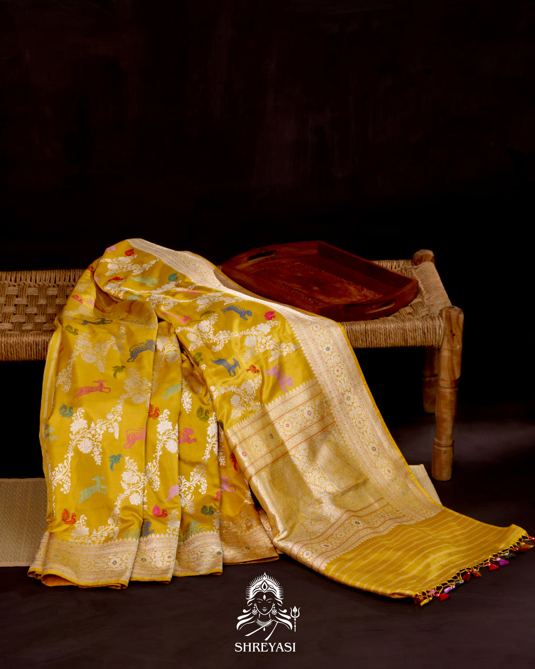 Banarasi Ektara silk saree in marigold yellow with kadhwa meenakari animal motifs and full zari border