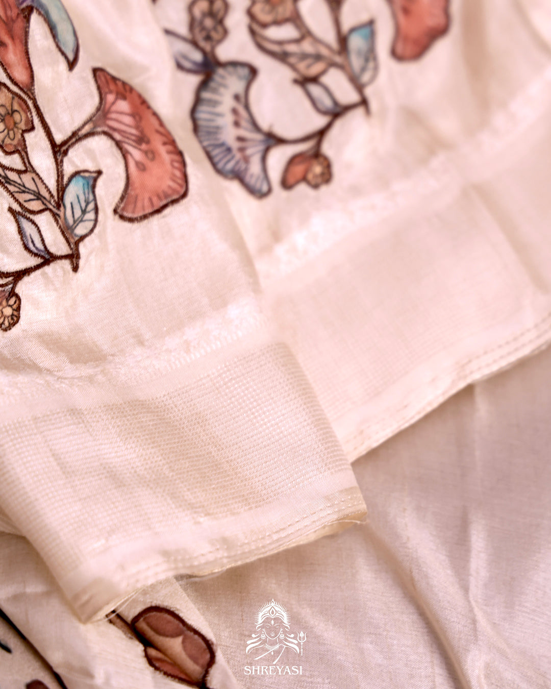 Kota saree with floral kalamkari appliqué work, contrast border, and lightweight breathable drape