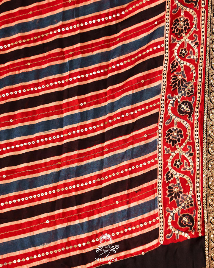 Handloom Pure Modal Silk Ajrakh Hand Block Printed Saree with Natural Dyes, All Over Aari Embroidery & Embroidered Borders
