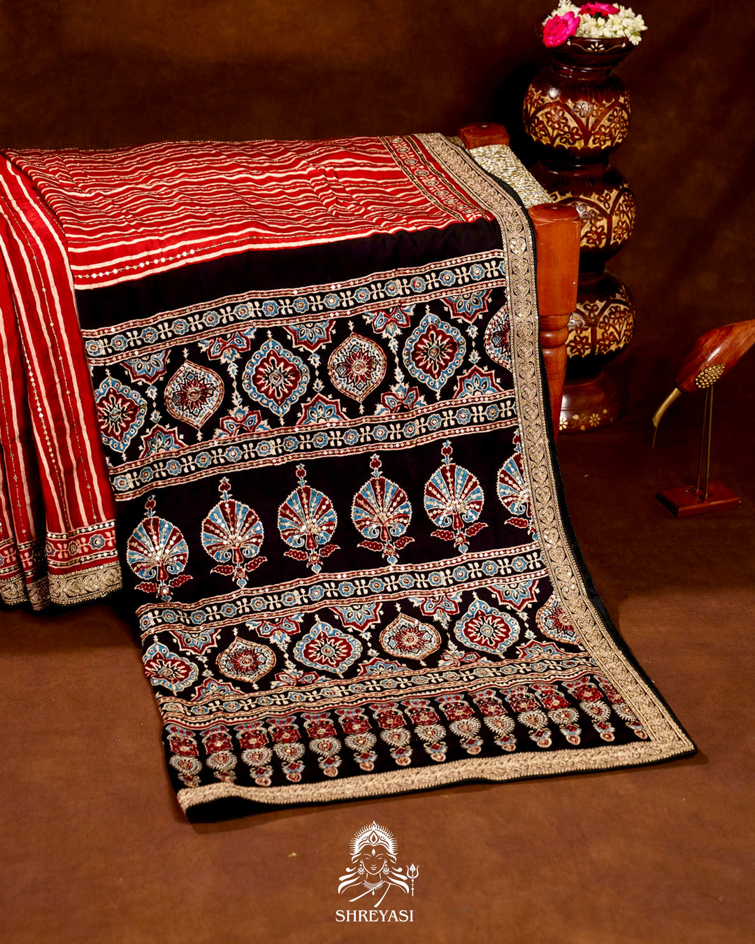 Handloom Pure Modal Silk Ajrakh Hand Block Printed Saree with Natural Dyes, All Over Aari Embroidery & Embroidered Borders