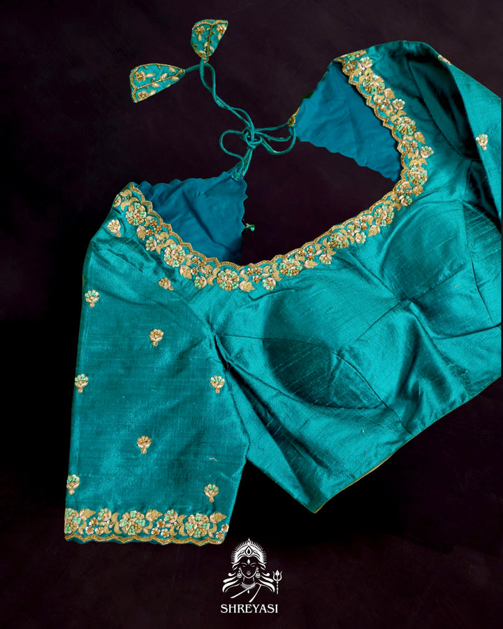 Banarasi Ektara silk saree in soft green with jamdani-style cutwork motifs and subtle woven border