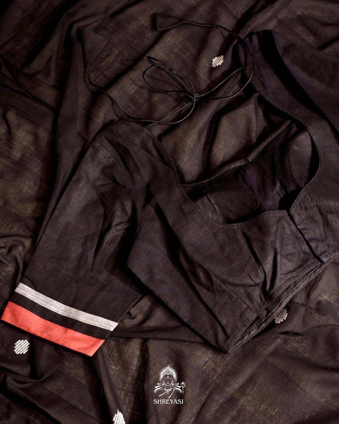 Handloom Bawan Buta cotton saree featuring traditional Jamdani woven motifs and contrast borders