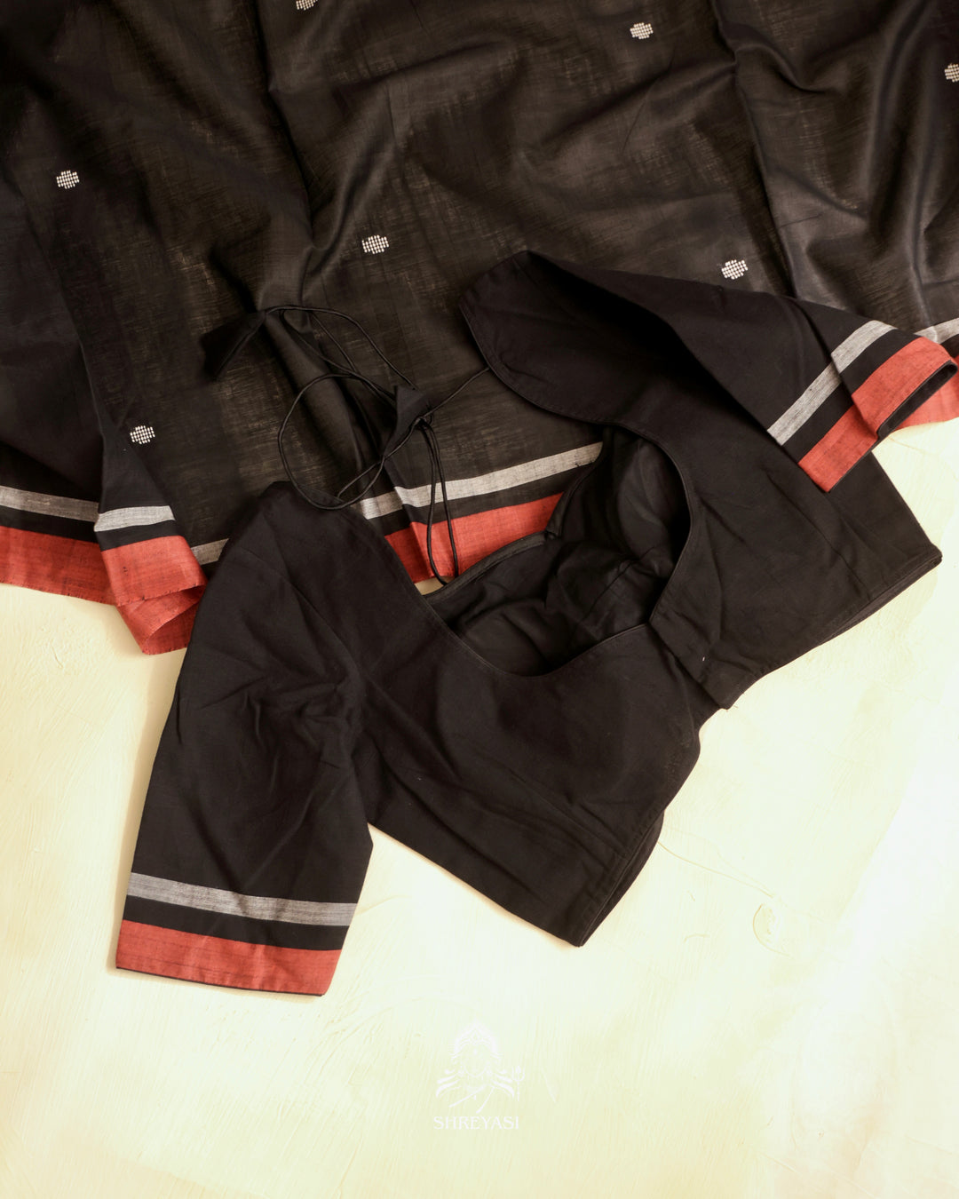 Handloom Bawan Buta cotton saree featuring traditional Jamdani woven motifs and contrast borders