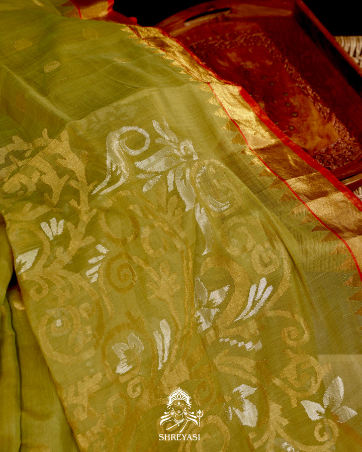 Ponduru Khadi Jamdani saree in olive green with handwoven jamdani motifs and contrast orange border