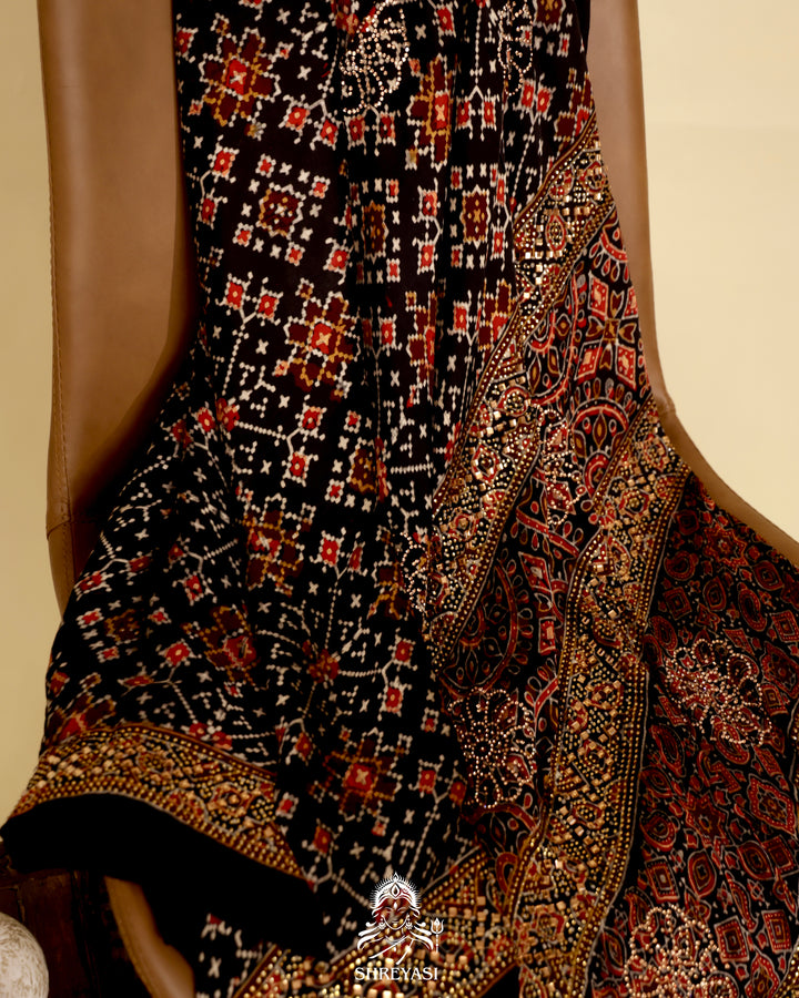 Ajrakh modal silk saree with traditional geometric prints and subtle Swarovski bead embellishment on a black base