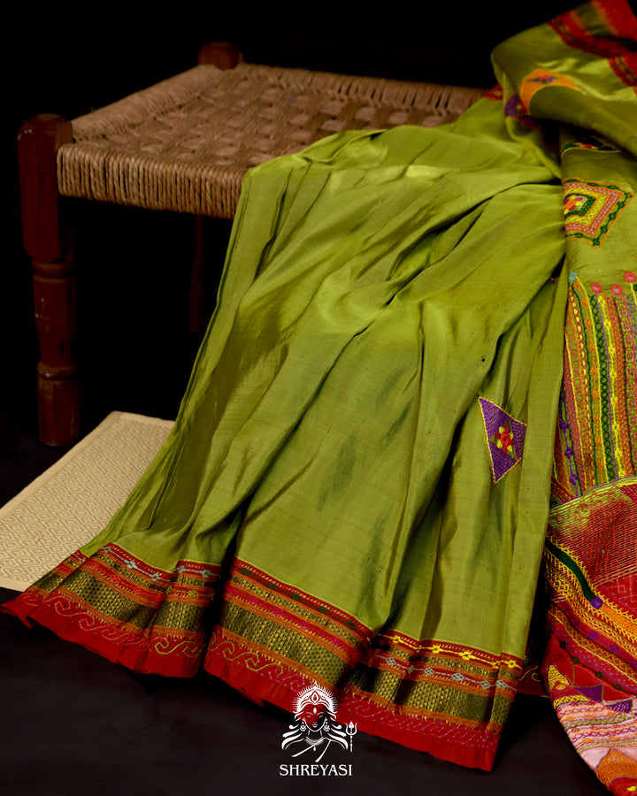 Handloom pure Ilkal silk saree featuring traditional Lambani embroidery with mirror work and geometric stitch patterns