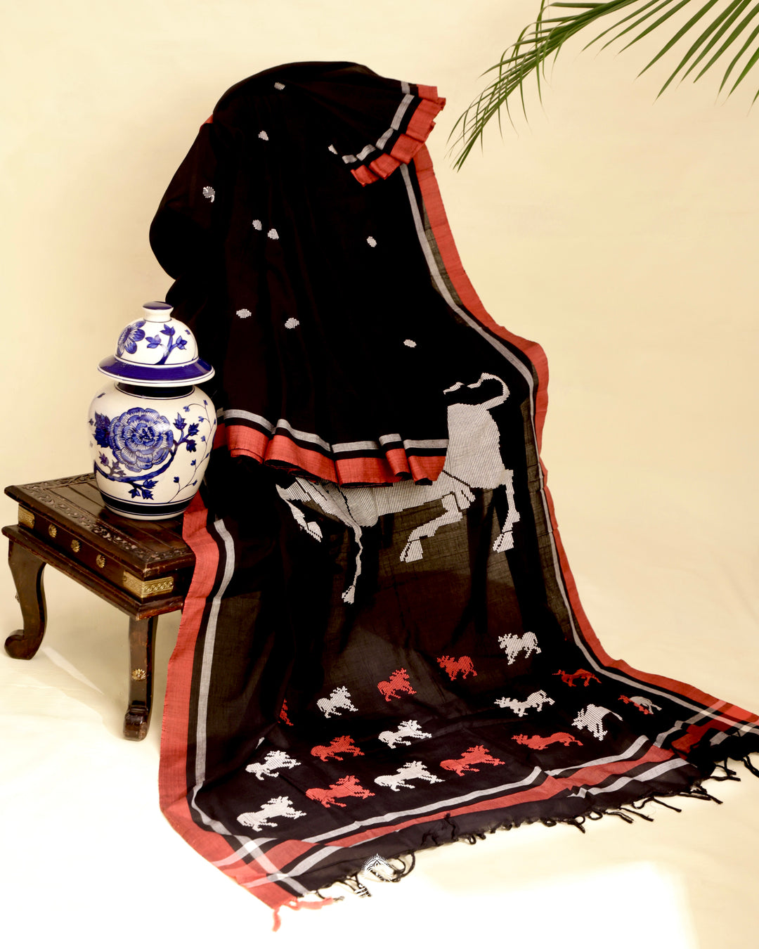 Handloom Bawan Buta cotton saree featuring traditional Jamdani woven motifs and contrast borders