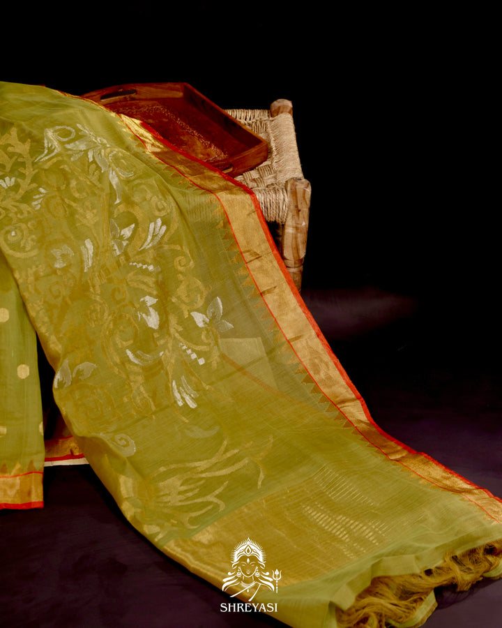 Ponduru Khadi Jamdani saree in olive green with handwoven jamdani motifs and contrast orange border