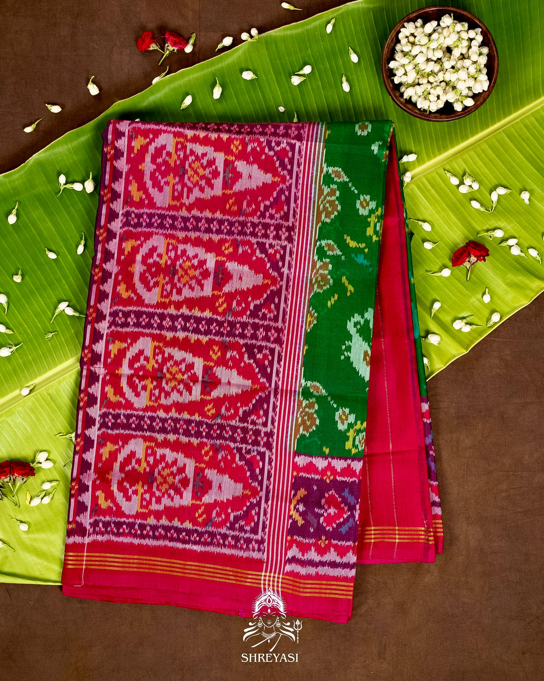 Handloom Pure Rajkot Patola Silk Saree in Emerald Green with Animal & Floral Ikat Motifs