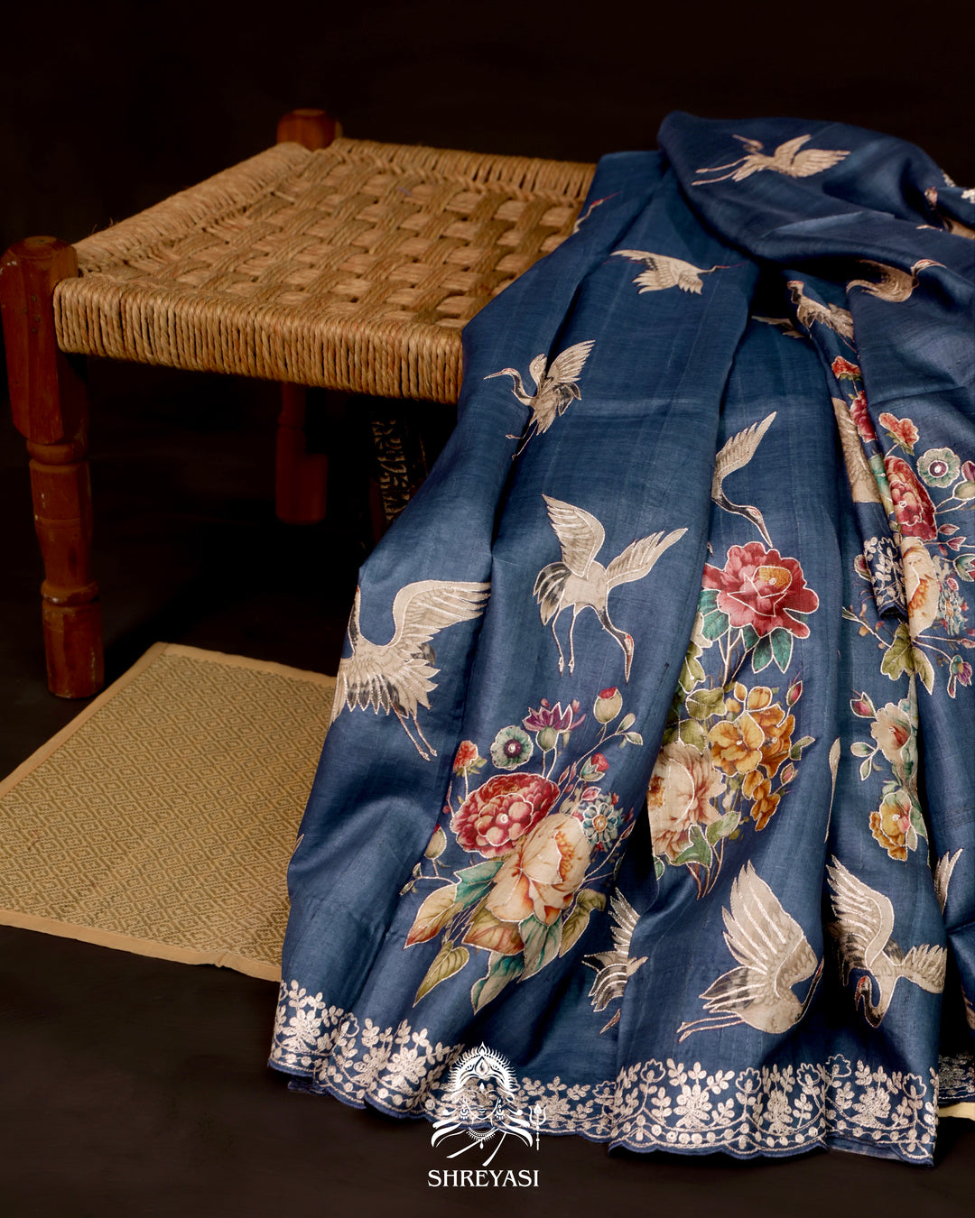Digital floral and bird motifs scattered across tussar silk saree body