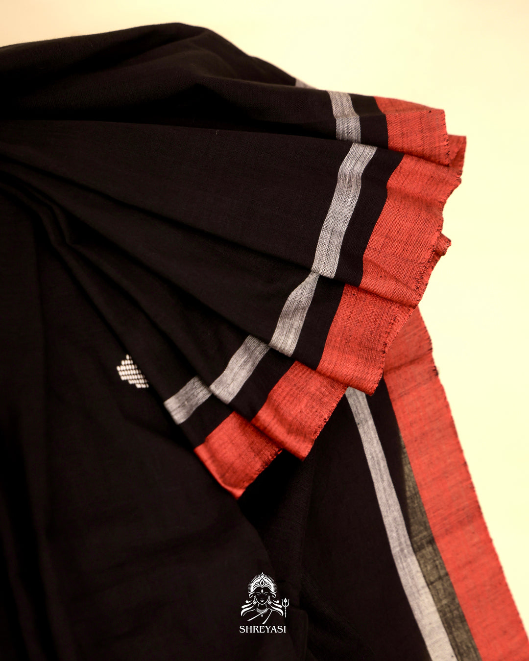 Handloom Bawan Buta cotton saree featuring traditional Jamdani woven motifs and contrast borders