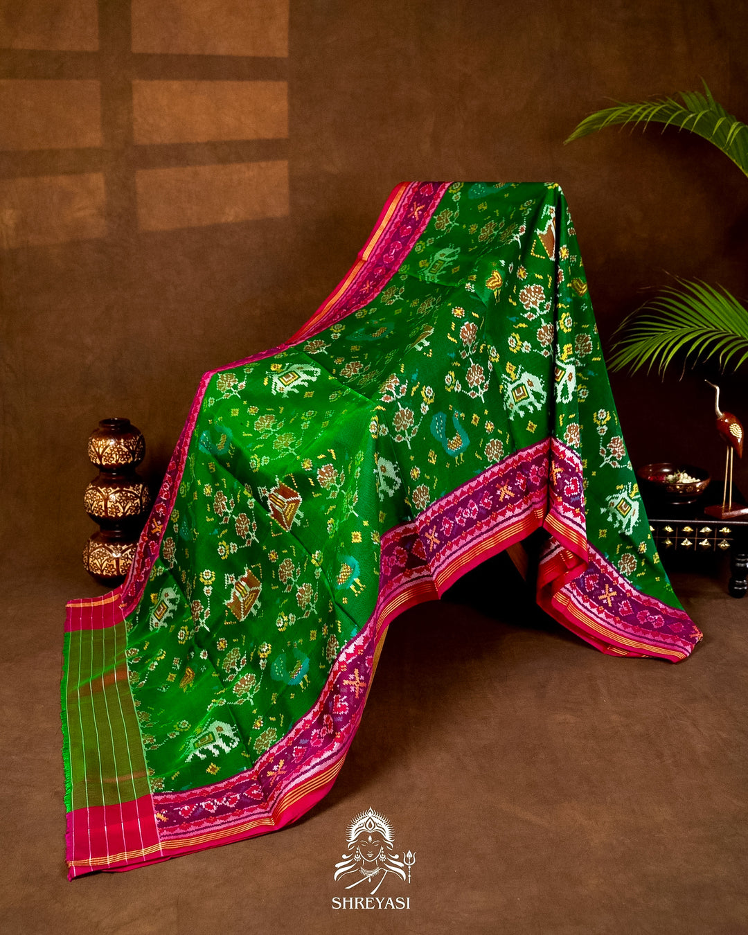 Handloom Pure Rajkot Patola Silk Saree in Emerald Green with Animal & Floral Ikat Motifs