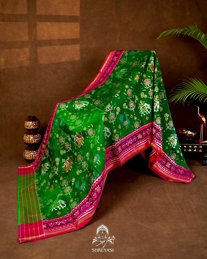 Handloom Pure Rajkot Patola Silk Saree in Emerald Green with Animal & Floral Ikat Motifs