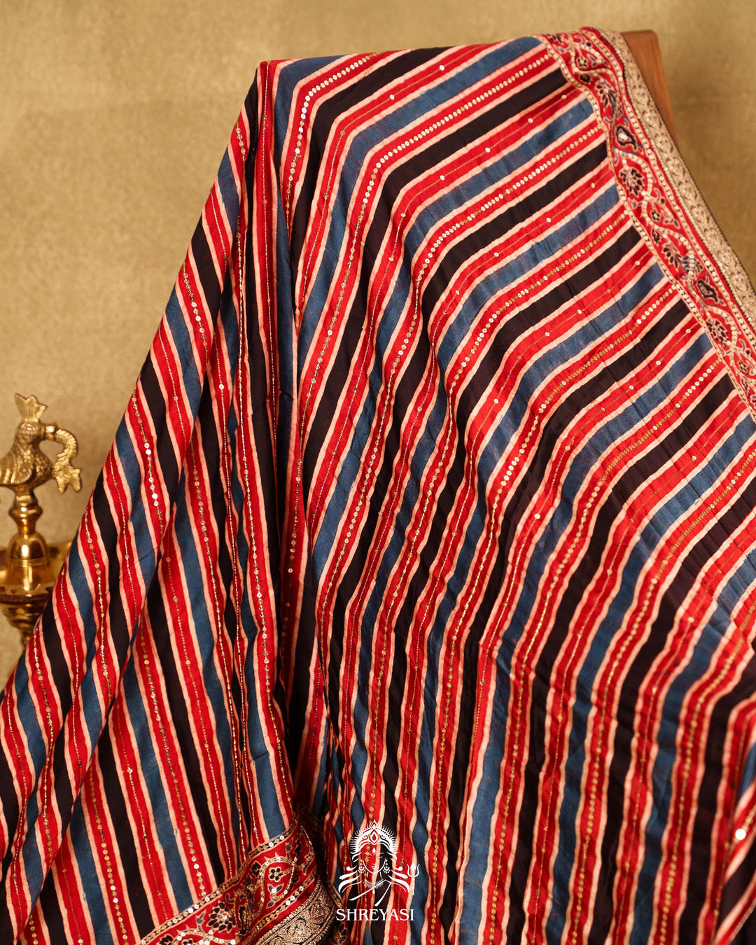 Handloom Pure Modal Silk Ajrakh Hand Block Printed Saree with Natural Dyes, All Over Aari Embroidery & Embroidered Borders