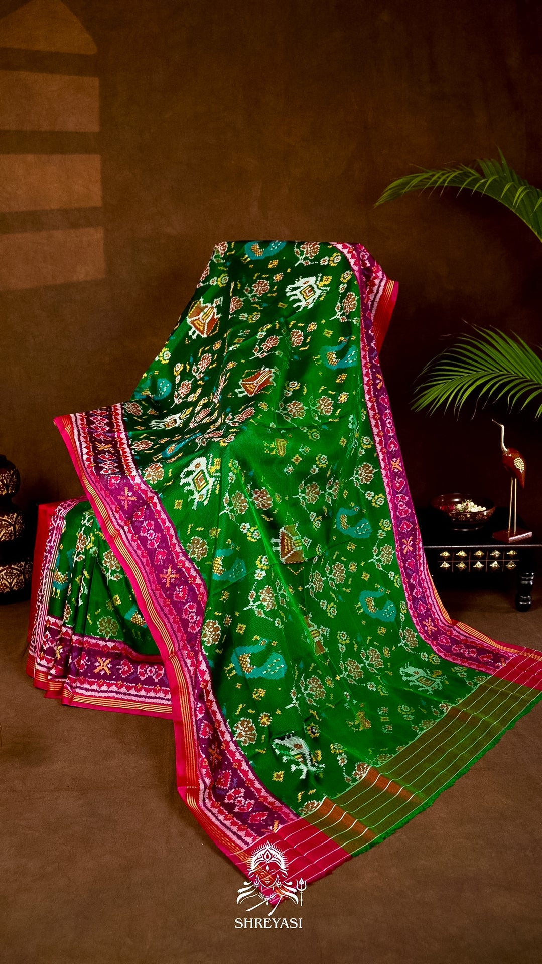 Handloom Pure Rajkot Patola Silk Saree in Emerald Green with Animal & Floral Ikat Motifs