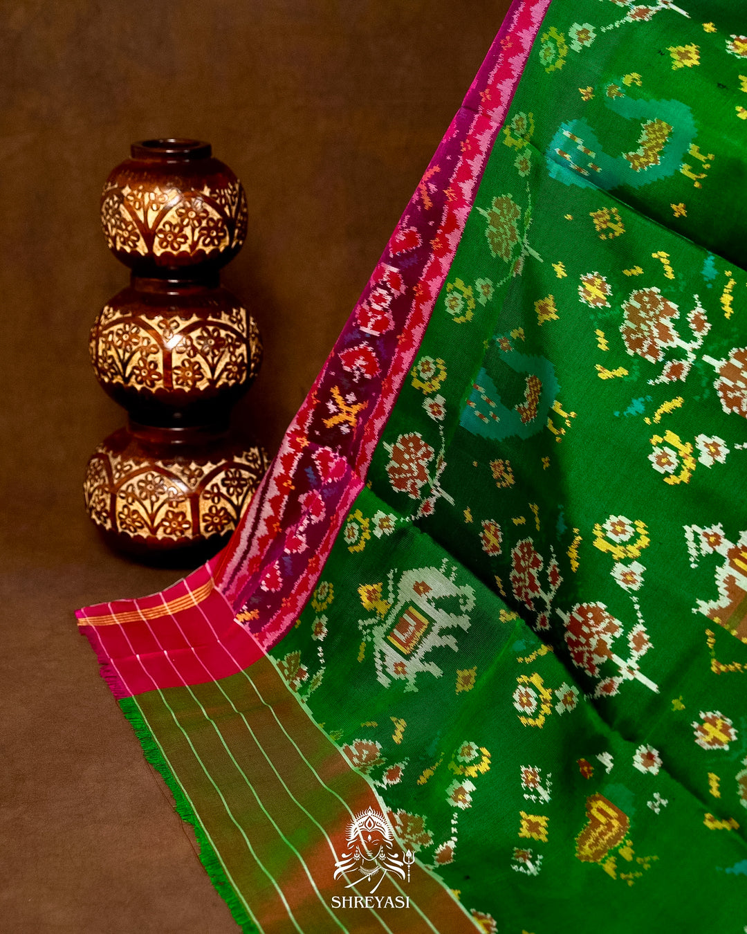 Handloom Pure Rajkot Patola Silk Saree in Emerald Green with Animal & Floral Ikat Motifs