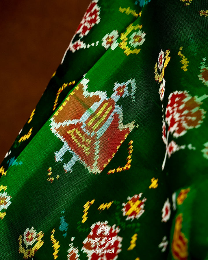 Handloom Pure Rajkot Patola Silk Saree in Emerald Green with Animal & Floral Ikat Motifs