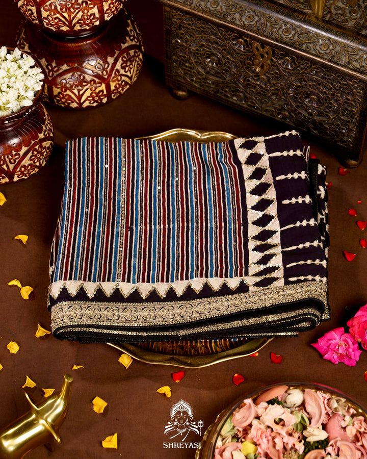 Handloom Pure Modal Silk Ajrakh Hand Block Printed Saree with Natural Dyes, All Over Aari Embroidery & Embroidered Borders