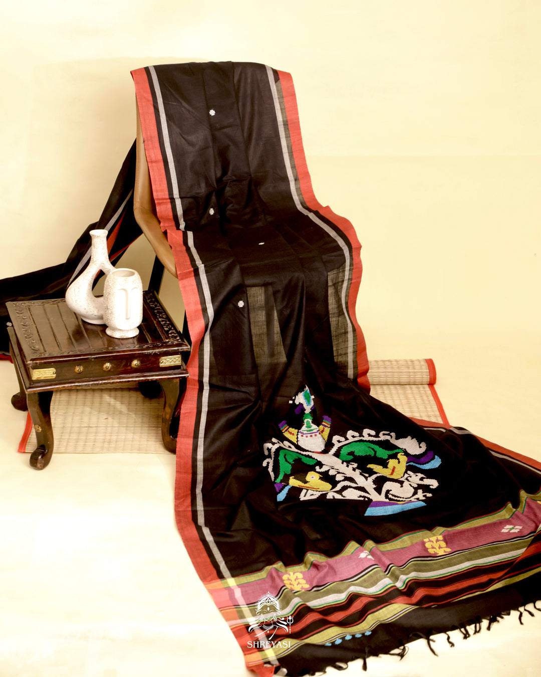 Handloom Bawan Buta cotton saree featuring traditional Jamdani woven motifs and contrast borders