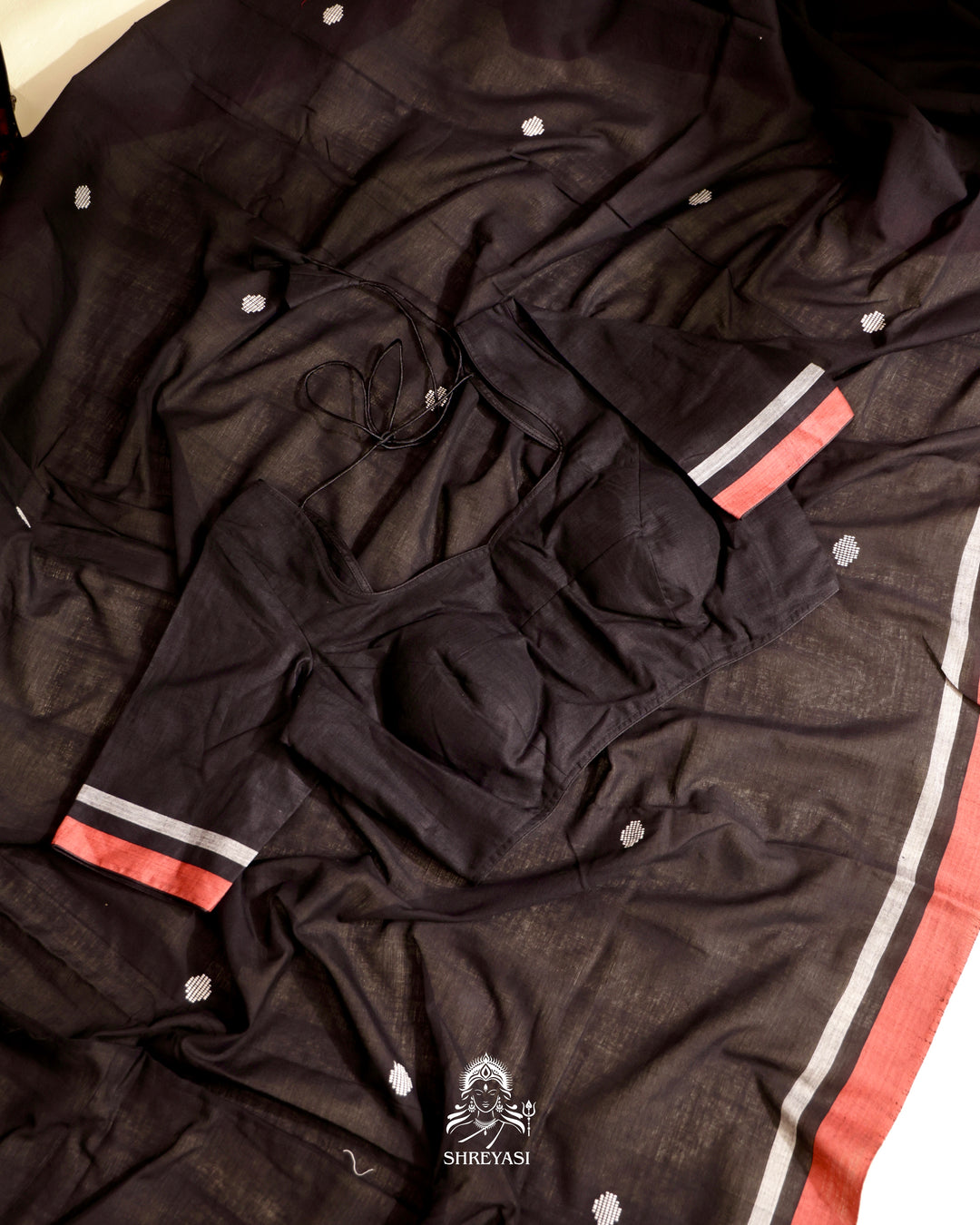 Handloom Bawan Buta cotton saree featuring traditional Jamdani woven motifs and contrast borders