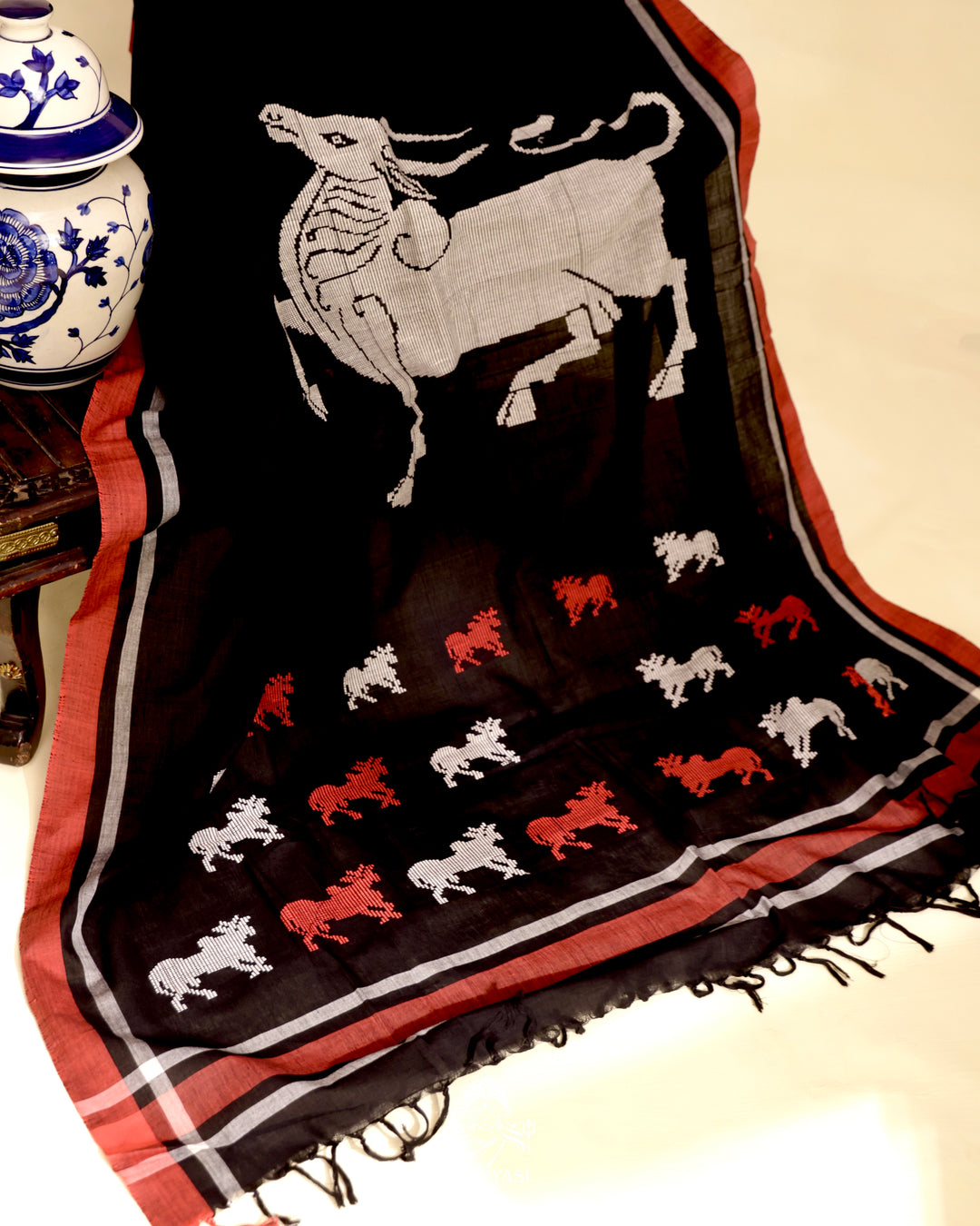 Handloom Bawan Buta cotton saree featuring traditional Jamdani woven motifs and contrast borders