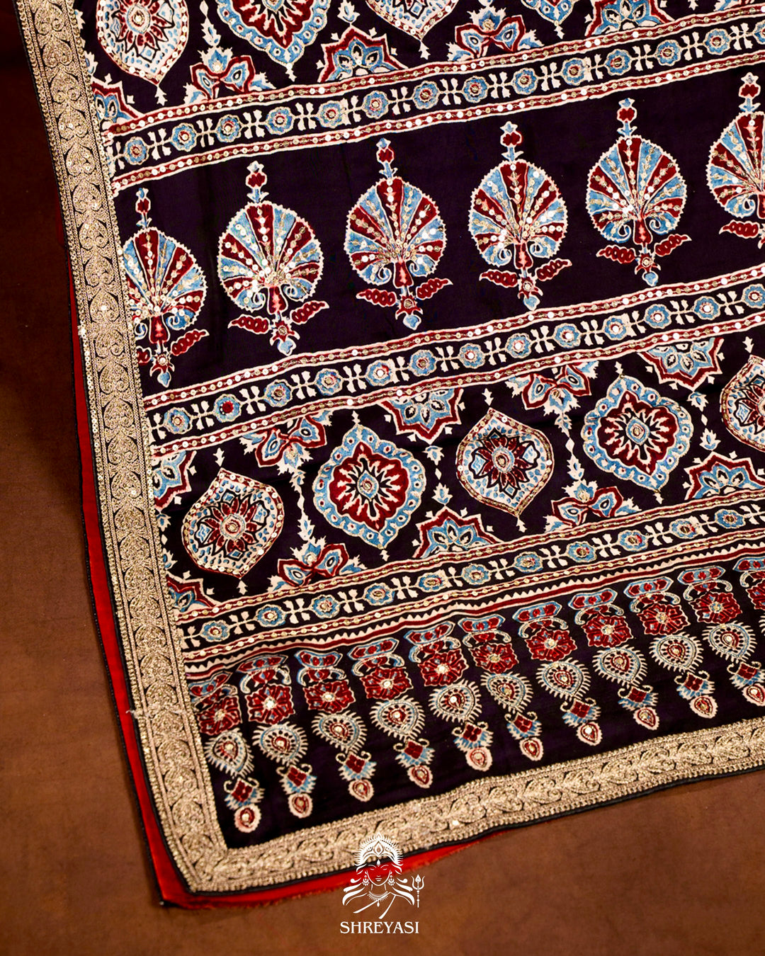 Handloom Pure Modal Silk Ajrakh Hand Block Printed Saree with Natural Dyes, All Over Aari Embroidery & Embroidered Borders