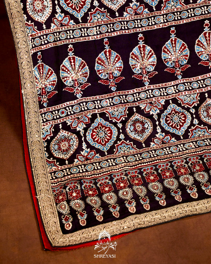 Handloom Pure Modal Silk Ajrakh Hand Block Printed Saree with Natural Dyes, All Over Aari Embroidery & Embroidered Borders