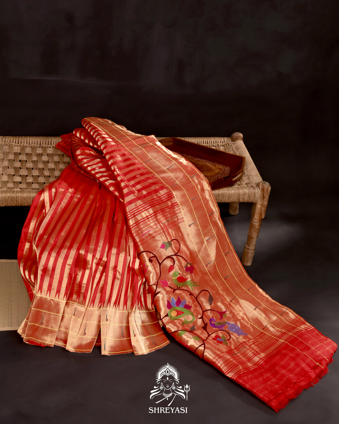 Handloom pure Paithani silk saree with woven zari stripes, delicate bhutis, and traditional Paithani motif designer pallu in vibrant hues