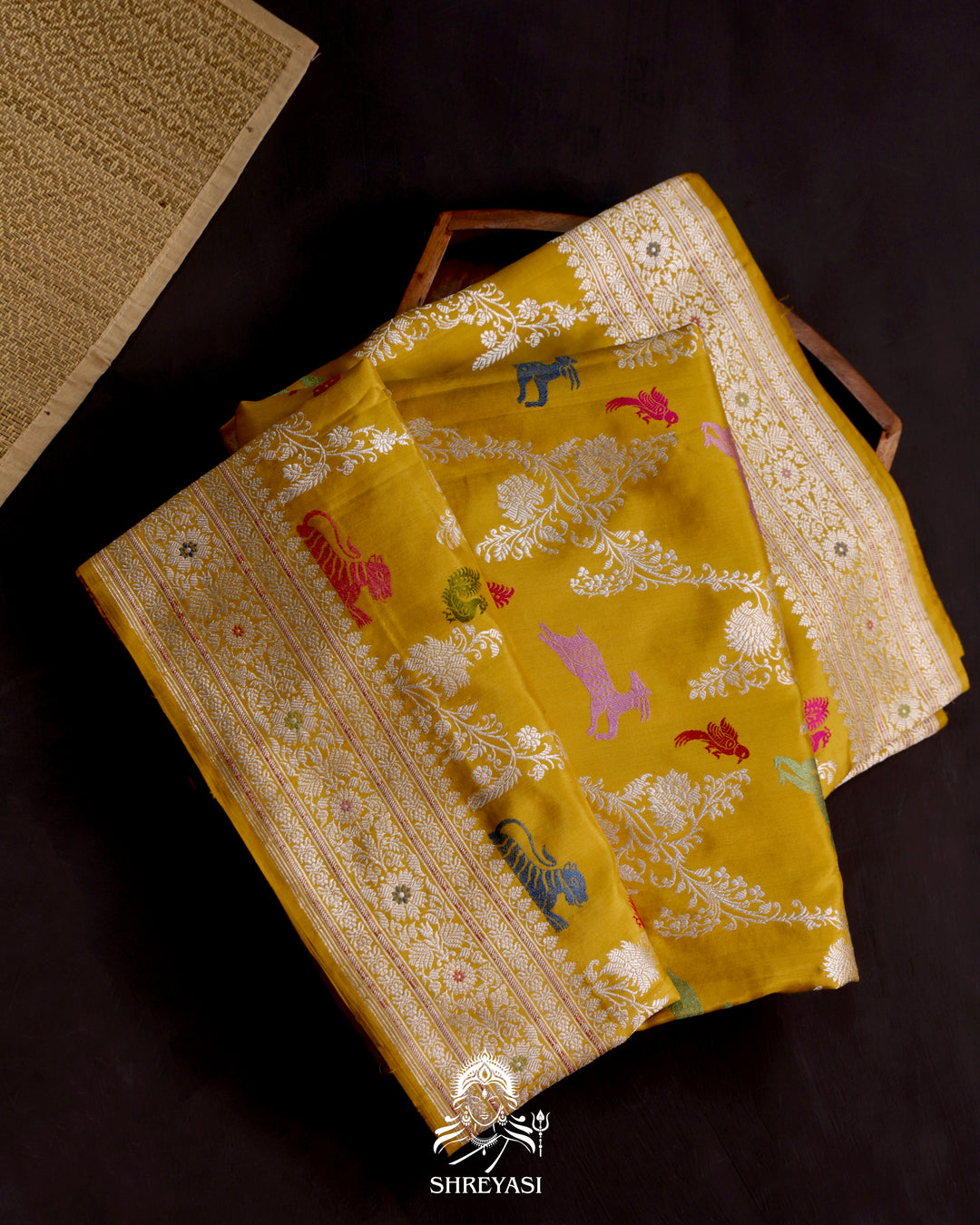 Banarasi Ektara silk saree in marigold yellow with kadhwa meenakari animal motifs and full zari border