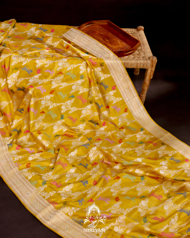 Banarasi Ektara silk saree in marigold yellow with kadhwa meenakari animal motifs and full zari border