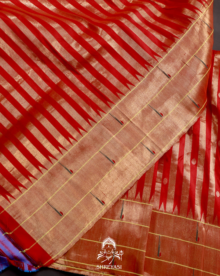 Handloom pure Paithani silk saree with woven zari stripes, delicate bhutis, and traditional Paithani motif designer pallu in vibrant hues