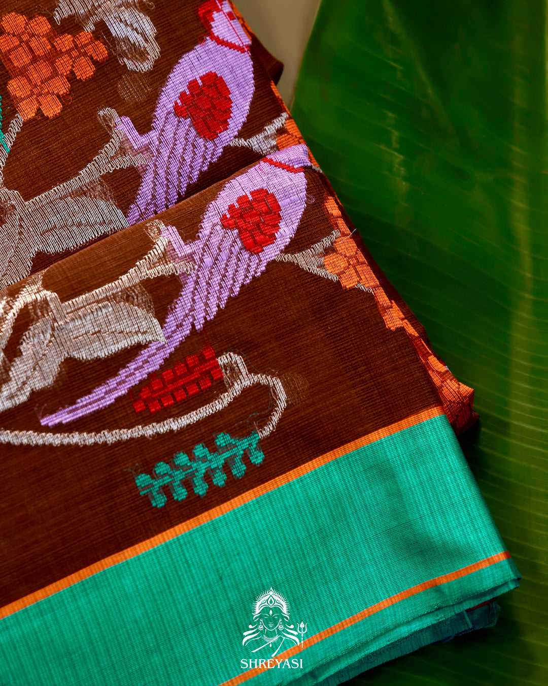Zari Kota Silk Saree with Bird Motifs and Contrast Turquoise Blouse