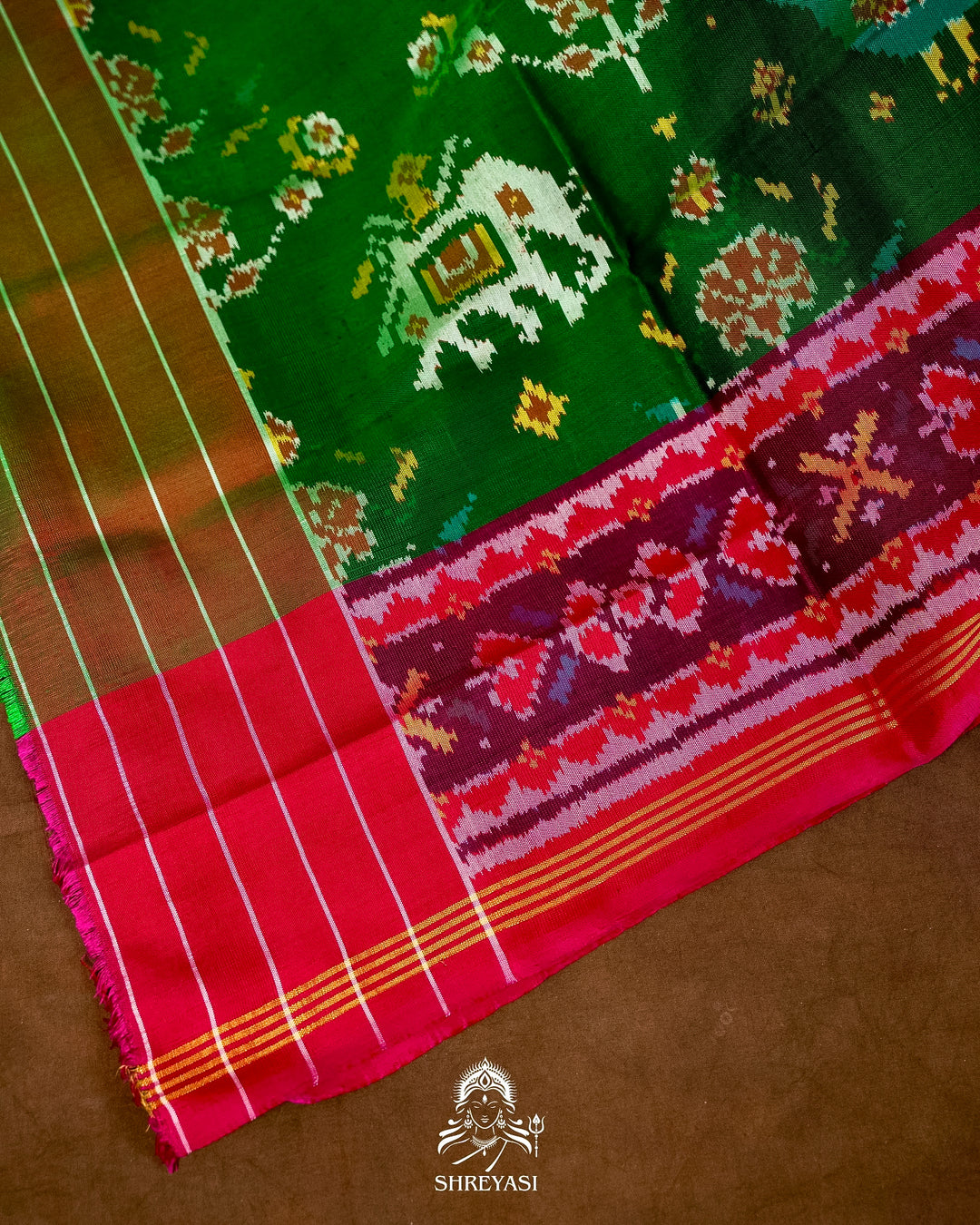 Handloom Pure Rajkot Patola Silk Saree in Emerald Green with Animal & Floral Ikat Motifs