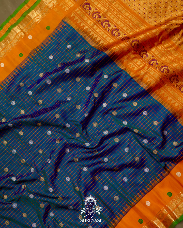 Handloom Pure Gadwal Silk Saree
in Kuttu Weaving and Rich Zari Pallu
