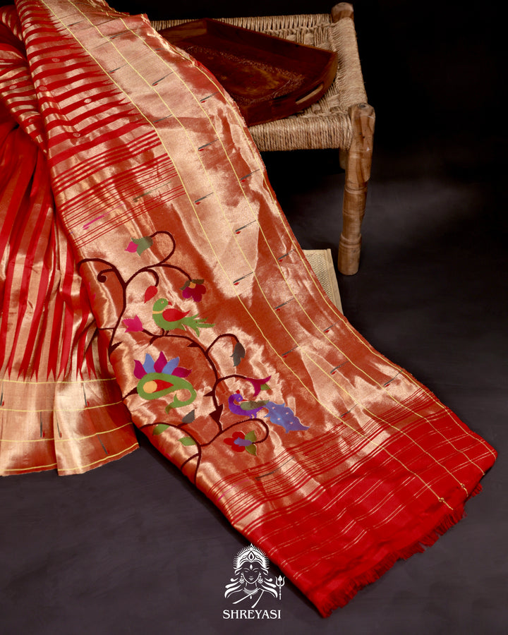 Handloom pure Paithani silk saree with woven zari stripes, delicate bhutis, and traditional Paithani motif designer pallu in vibrant hues
