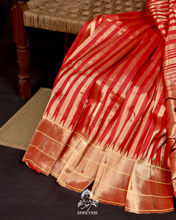 Handloom pure Paithani silk saree with woven zari stripes, delicate bhutis, and traditional Paithani motif designer pallu in vibrant hues