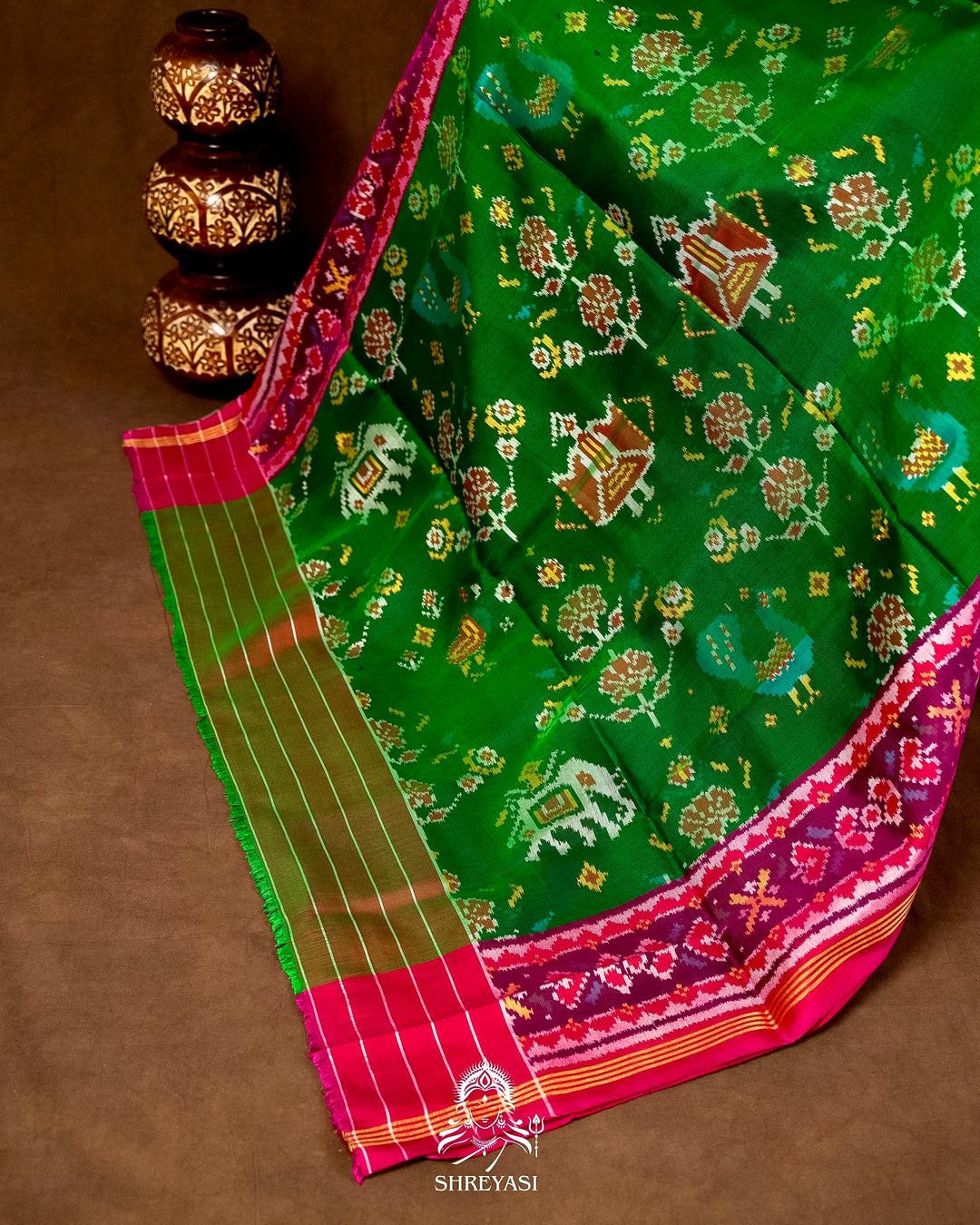 Handloom Pure Rajkot Patola Silk Saree in Emerald Green with Animal & Floral Ikat Motifs