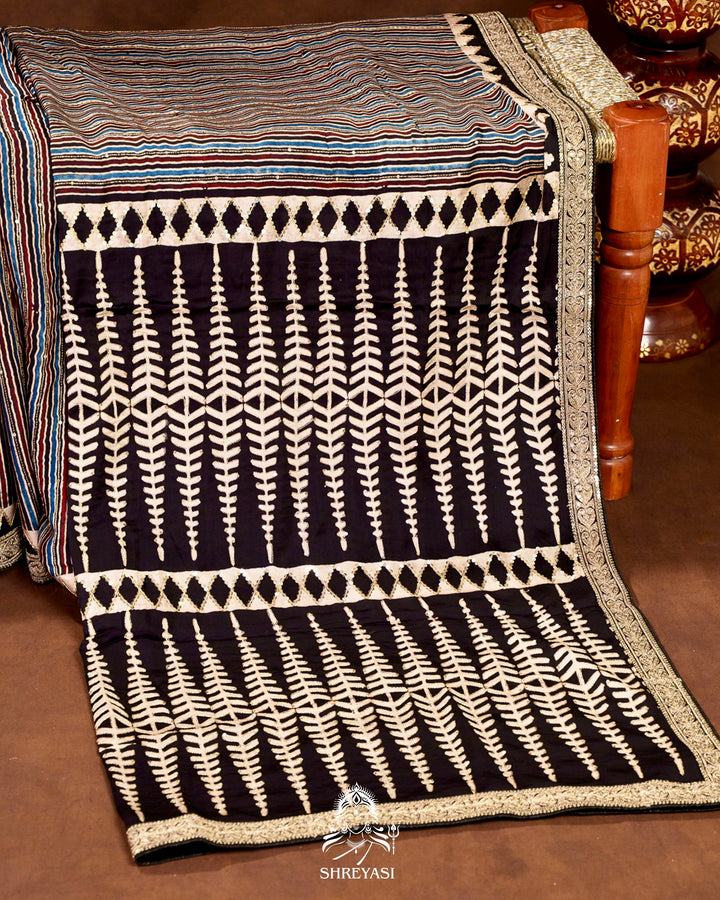 Handloom Pure Modal Silk Ajrakh Hand Block Printed Saree with Natural Dyes, All Over Aari Embroidery & Embroidered Borders
