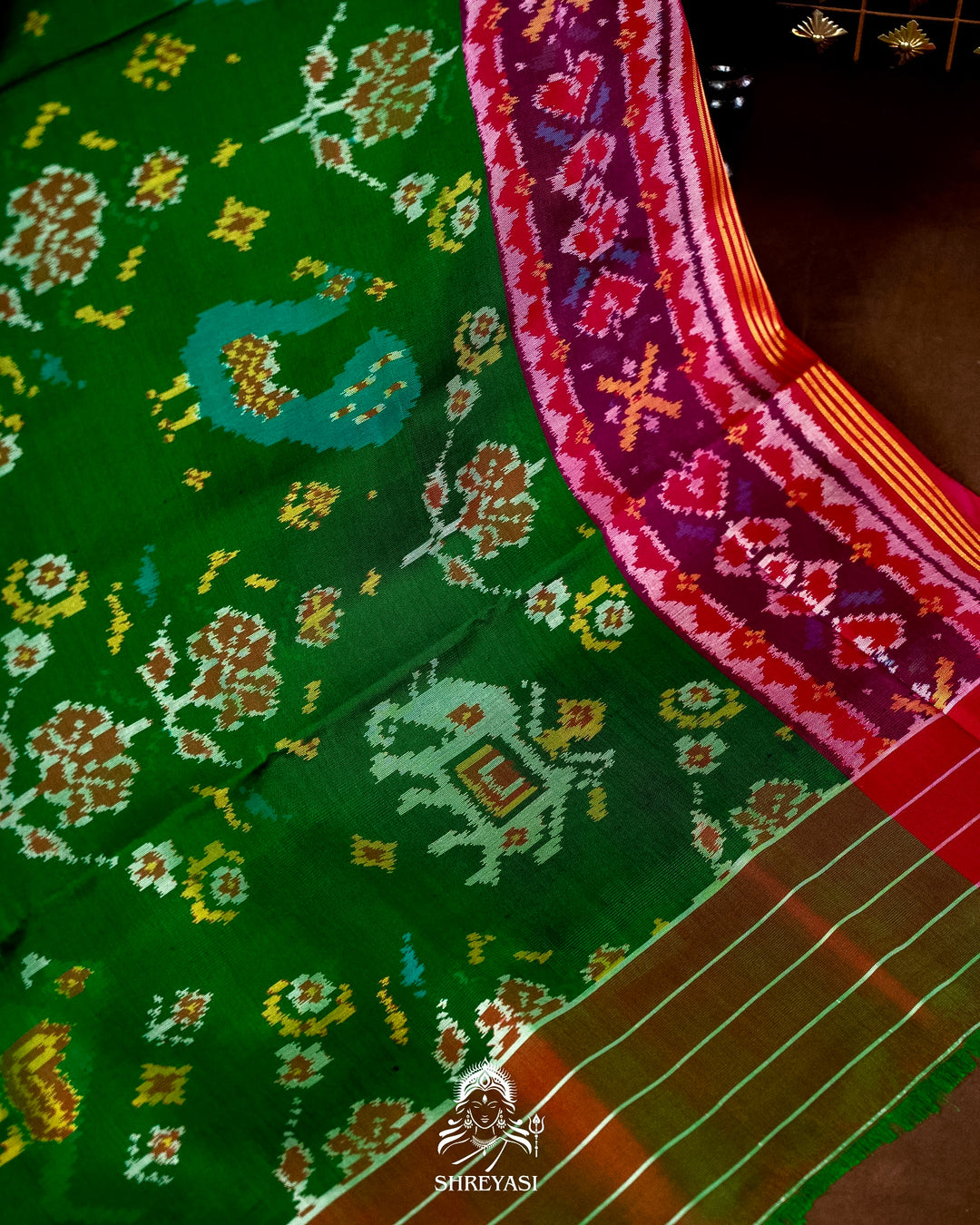 Handloom Pure Rajkot Patola Silk Saree in Emerald Green with Animal & Floral Ikat Motifs