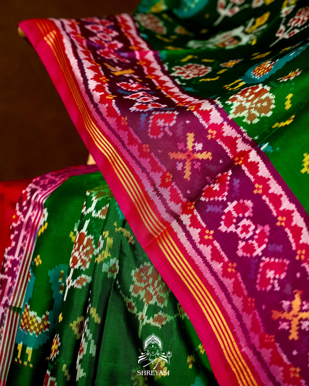 Handloom Pure Rajkot Patola Silk Saree in Emerald Green with Animal & Floral Ikat Motifs
