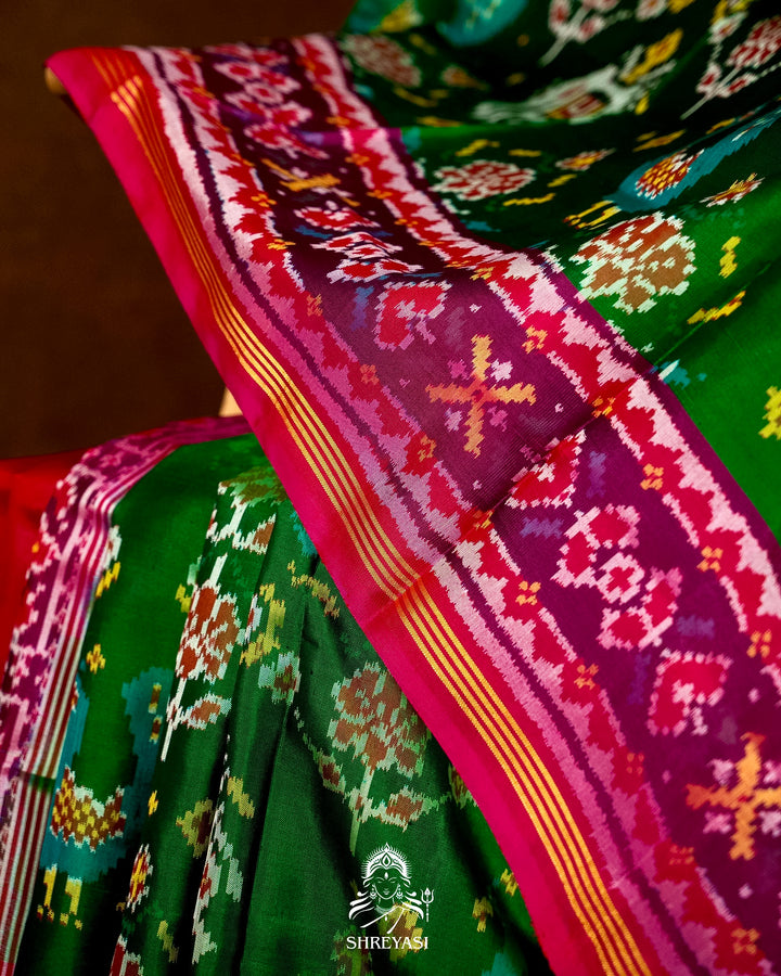 Handloom Pure Rajkot Patola Silk Saree in Emerald Green with Animal & Floral Ikat Motifs