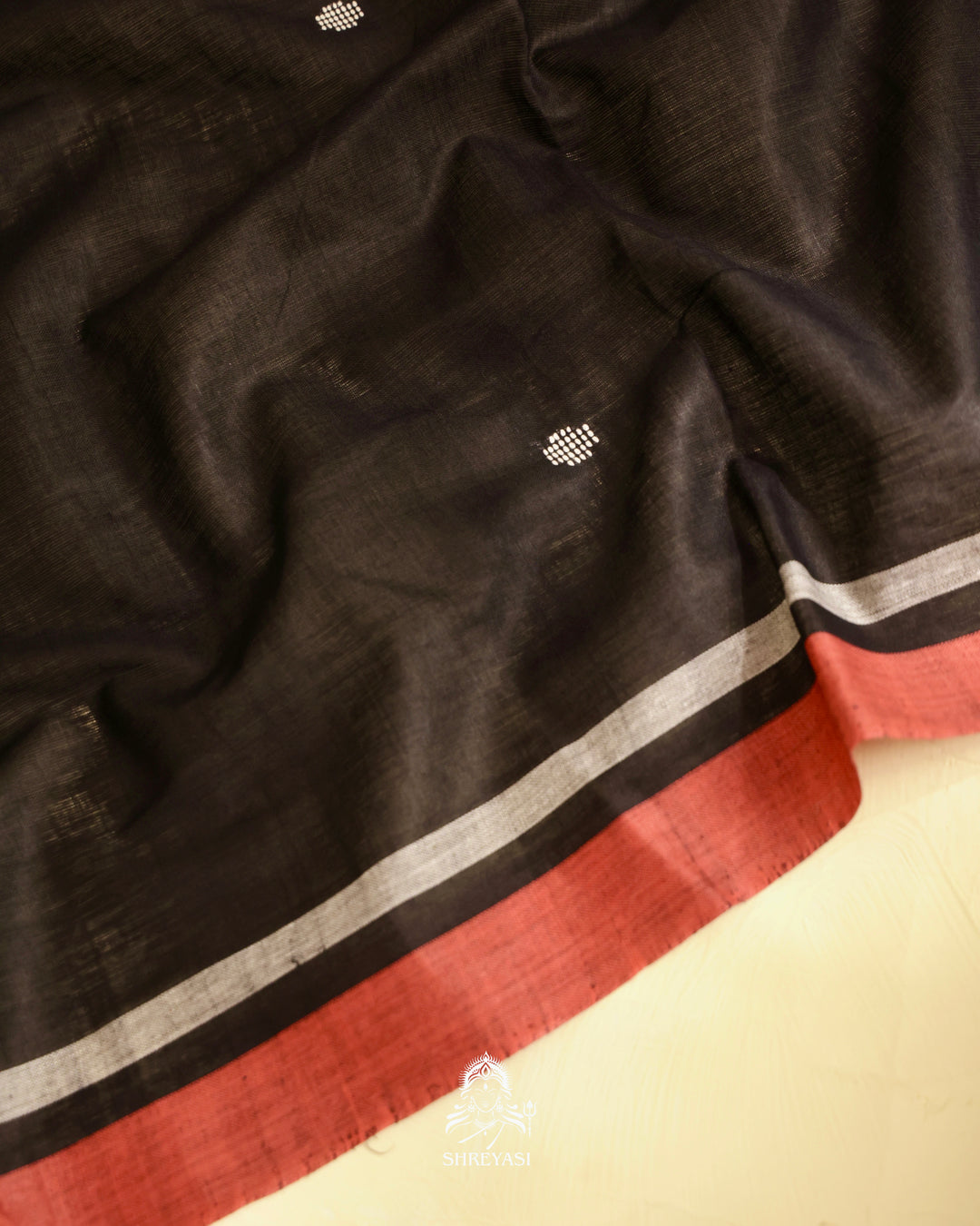 Handloom Bawan Buta cotton saree featuring traditional Jamdani woven motifs and contrast borders